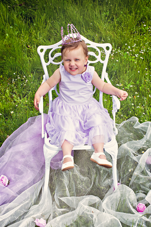 Smiling cute little princess outdoorの写真素材
