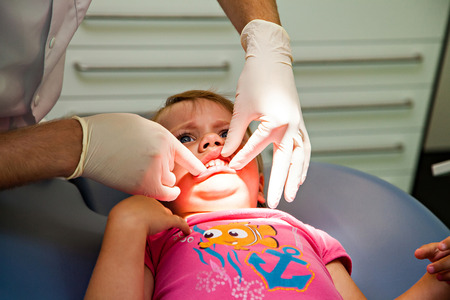 Little girl by dentist, dental examinationの写真素材