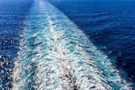 Cruise ship wake or trail on ocean surfaceの写真素材