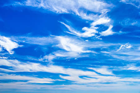 Fleecy clouds in blue sky
