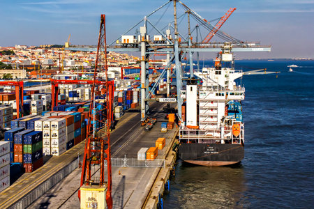 Cranes working at a cargo ship, Lisbon shipyard, Portugal