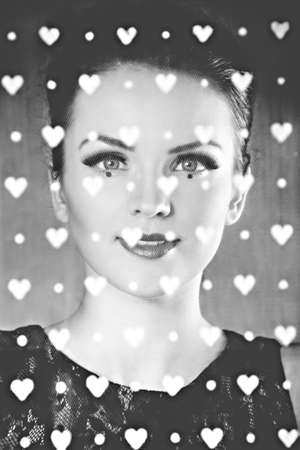 Elegant woman with artistic make-up looking through the tulleの写真素材