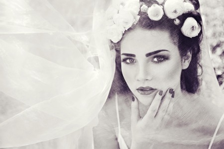 Bride with wreath of natural buttercup on headの写真素材