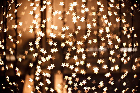 Defocused yellow sparkles - gold starsの写真素材