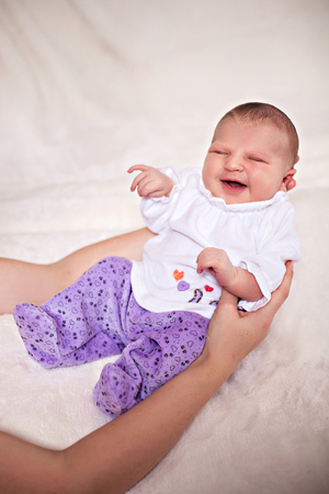 Photo of newborn baby in mother's armsの写真素材