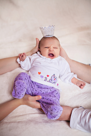 Photo of newborn baby  in mother's and papa's handsの写真素材