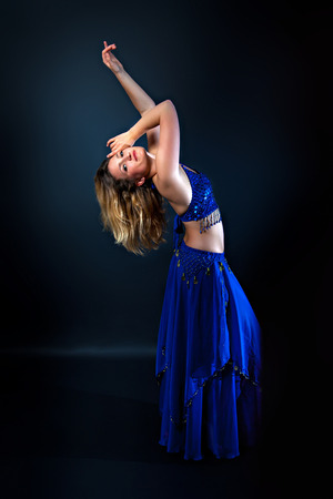 Female belly dancer in traditional costumeの写真素材