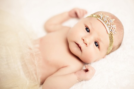Cute baby with a little crownの写真素材