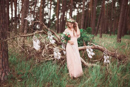 Boho Bride With Dream Catchers In Forestの写真素材