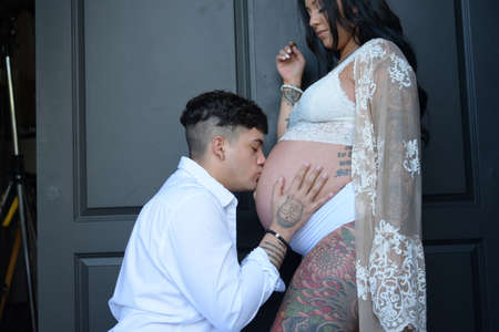 Pregnant couples wearing white clothesの写真素材