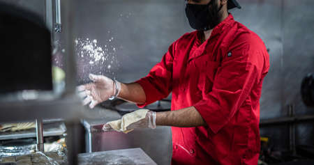Chef preparing cooking and serving indian cuisine style dish