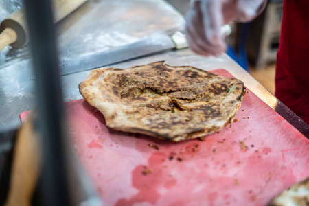Chef making a delicious traditional tandoori bread