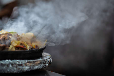 Indian kebab platter in hot sizzling plate