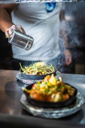 Indian kebab platter in hot sizzling plateの写真素材