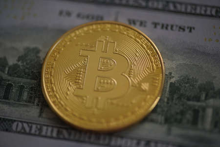 Bitcoin digital crypto currency logo with dollar bil