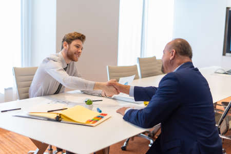 Office employee having a meeting with their teamの写真素材
