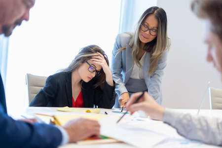 Office employee having a meeting with their teamの写真素材