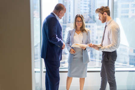 Office employee having a meeting with their teamの写真素材