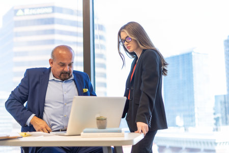 Office employee having a meeting with their team