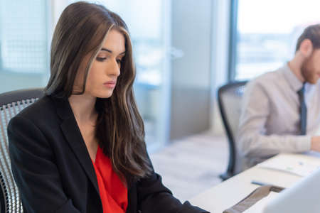 Office employee having a meeting with their team