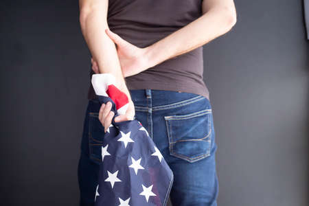 US flag and a silhouette of a manの写真素材