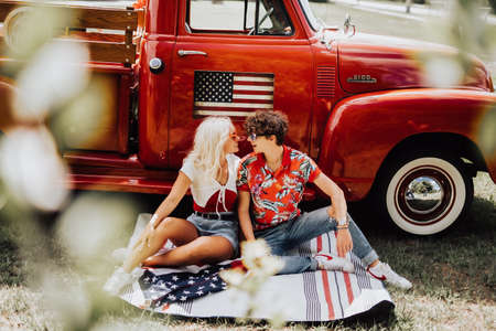 Couple in a vintage red truckの写真素材