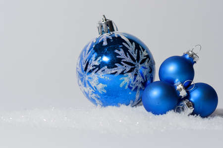 Glass ball Christmas ornament with bow. Christmas decorations in blue colorの写真素材