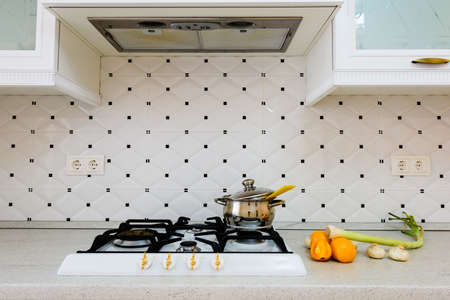 Cooking bowl with spaghetti on stove. Cooking meal in the kitchen. Vegetables and spaghetti