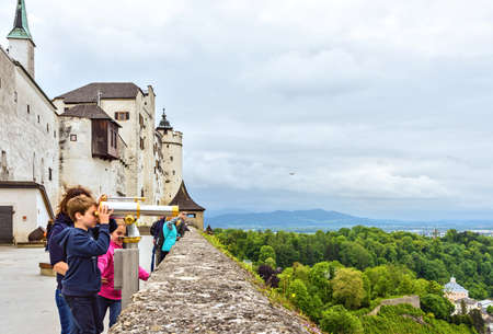 Family spending weekend at the Hohensalzburg fortress. Historic center of the city, Austria on  May 19th 2016のeditorial素材