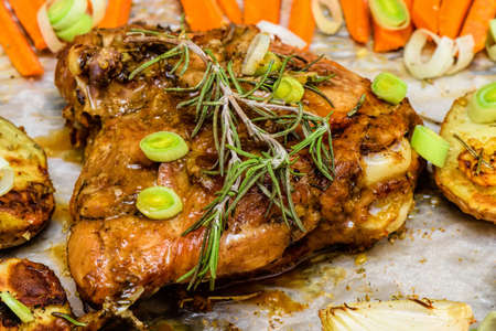 Roasted garlic and lemon turkey with vegetables and rosemary. Homemade dinnerの写真素材