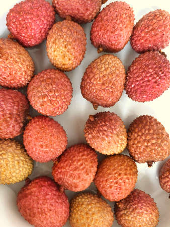 Lychee fruits in a white plate. Fresh delicious tropic fruitsの写真素材