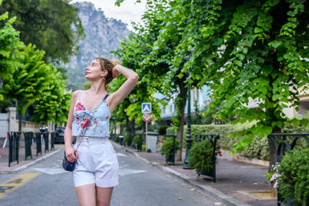 Woman portrait in Beaulieaux Sur Mer, France. Beautiful mountains backgroundsの写真素材