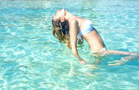 Woman swimming in the sea in Cyprus. Beautiful Summer sea viewsの写真素材
