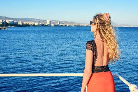 Woman enjoying the summer day portrait Limassol, Cyrpus. Sea view. Vintage stylesの写真素材