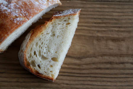 Bread slice and Bread loaf on wooden table