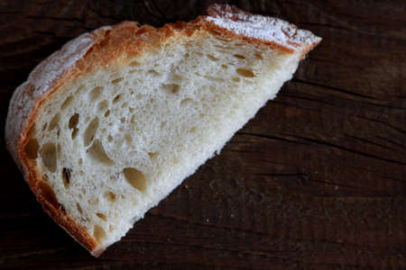 Bread slice on wooden tableの写真素材