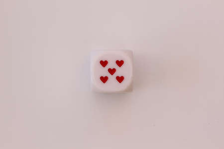 Dice with hearts isolated on white backgroundの写真素材
