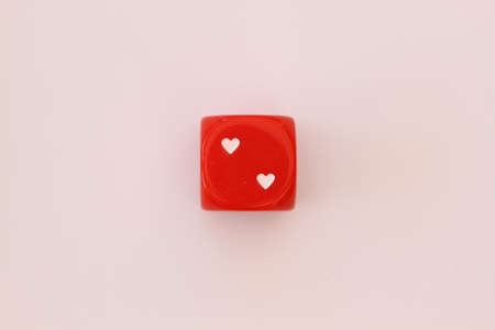 Dice with hearts isolated on white backgroundの写真素材