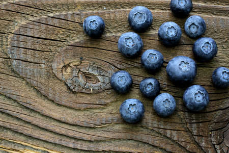 Group of blueberries on antique table top viewの写真素材