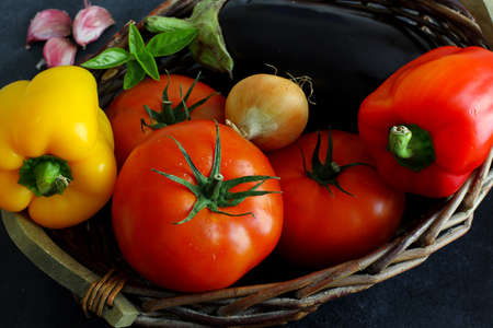 Variety of summer vegetables in market on dark board, top viewの写真素材
