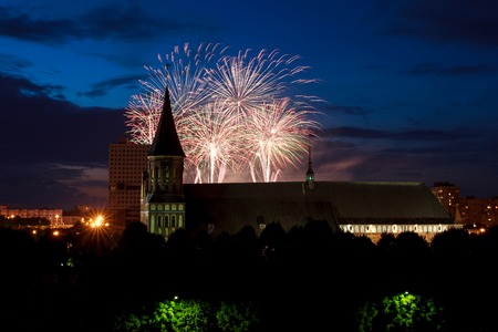 Fireworks over the cathedral on the island of Kant, Kaliningrad, Russiaの写真素材