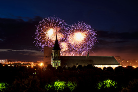 Fireworks over the cathedral on the island of Kant, Kaliningrad, Russiaの写真素材