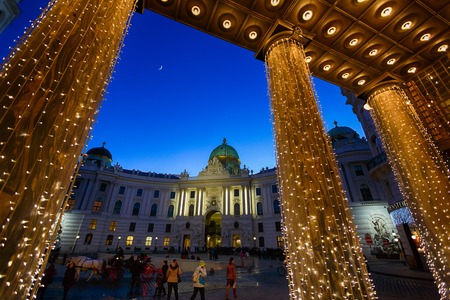 Hofburg Palace between garlands at night in Vienna, Austriaのeditorial素材