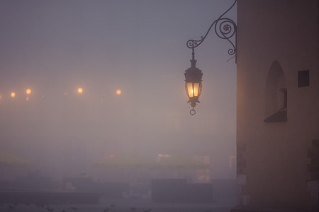 Lantern on market square in Krakow at morning fog, Polandの写真素材