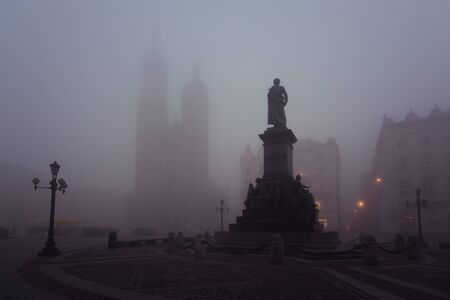 Market square in Krakow at morning fog, Polandの写真素材