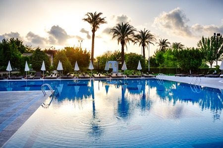 Swimming pool with crystal clear water awaits travelers on the background of mountain Tahtaliのeditorial素材