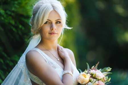 Portrait of beautiful bride in a forestの写真素材