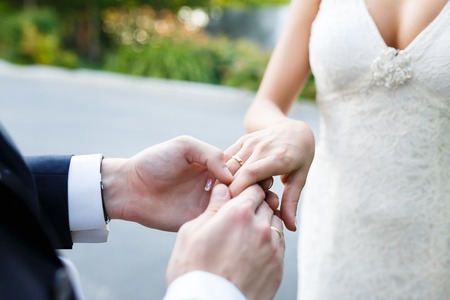 Hands of wedding couple on their happy dayの写真素材