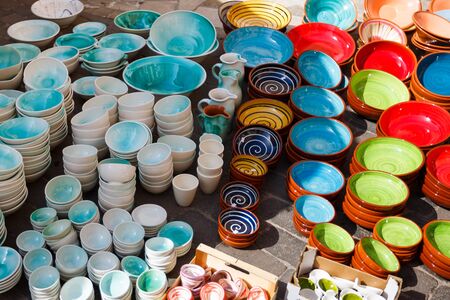 Traditional multi colored plates at the market in Santanyi city, Mallorcaの写真素材