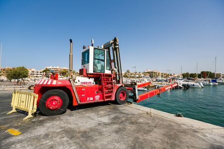 Colonia de Sant Jordi, Spain - July 05 2015: View of forklift for yachts in the marina bay at the summer dayのeditorial素材